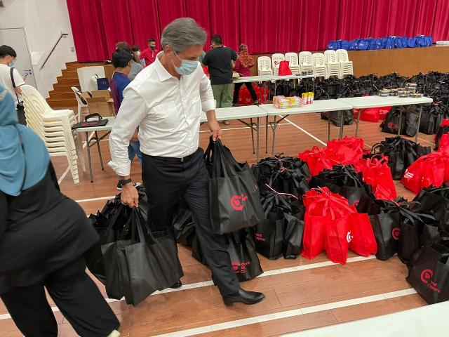 Church-Stake-President-Jean-Luc-Butel,-helping-with-packing.